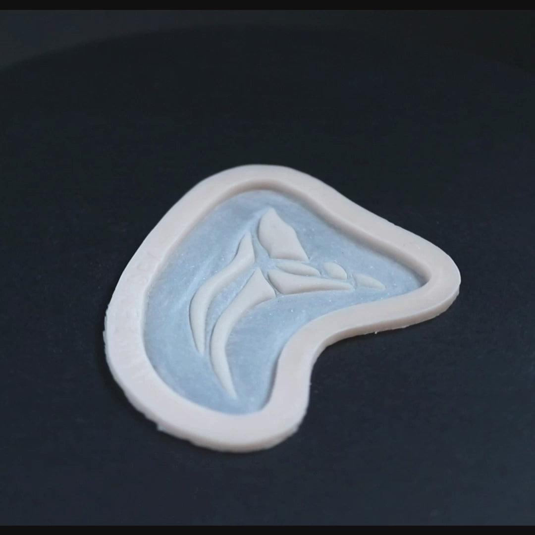 Anubis Mark prosthetic in vanilla shade on a black turntable, slowly rotating.