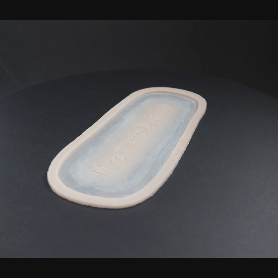 Missit Me Dominus prosthetic in vanilla shade on a black turntable, slowly rotating.