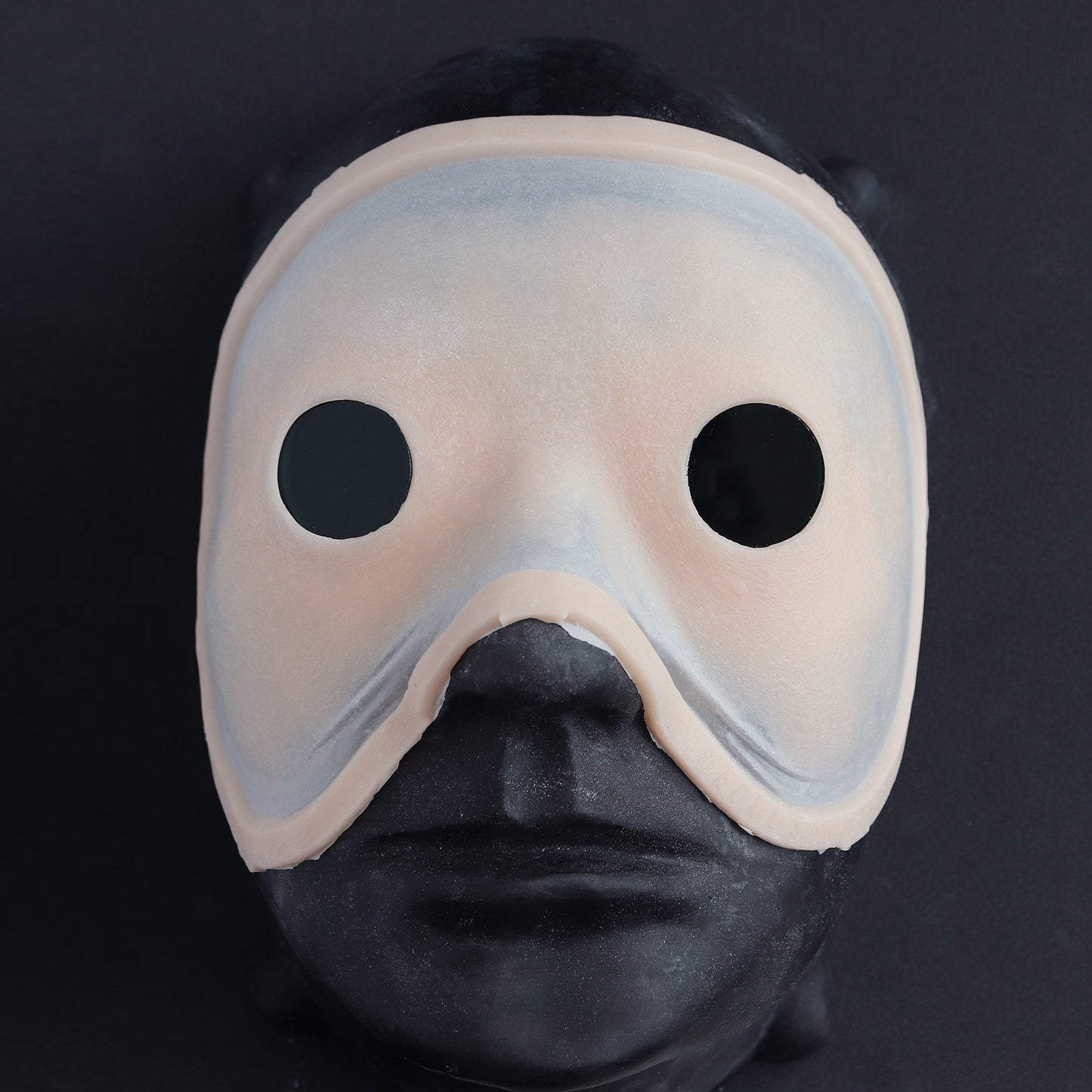 Eyeless - Silicone makeup prosthetic in vanilla shade on a black surface