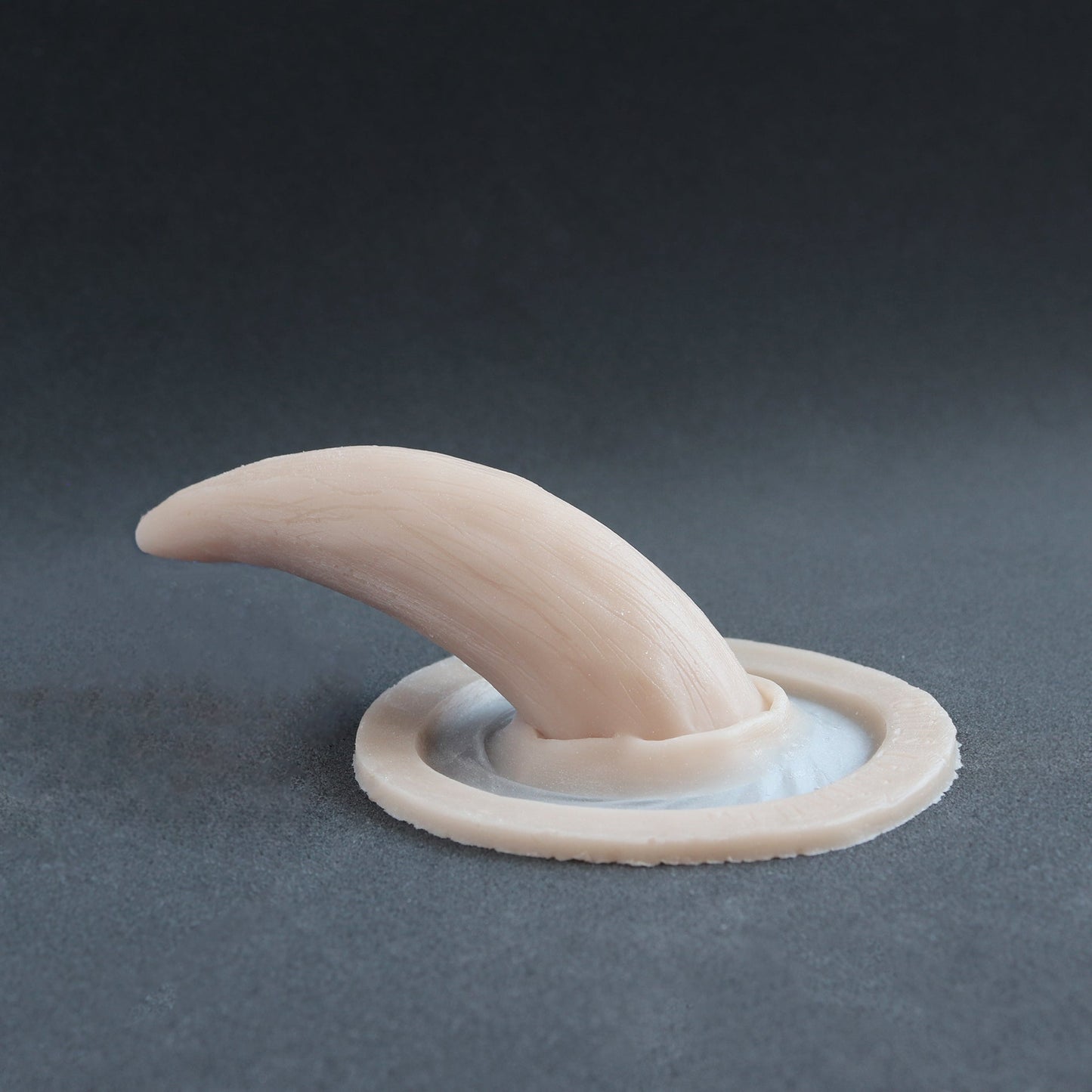 Oni Horns - Silicone makeup prosthetic in vanilla shade on a black surface