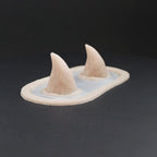 Devil Horns prosthetic in vanilla shade on a black turntable, slowly rotating. 