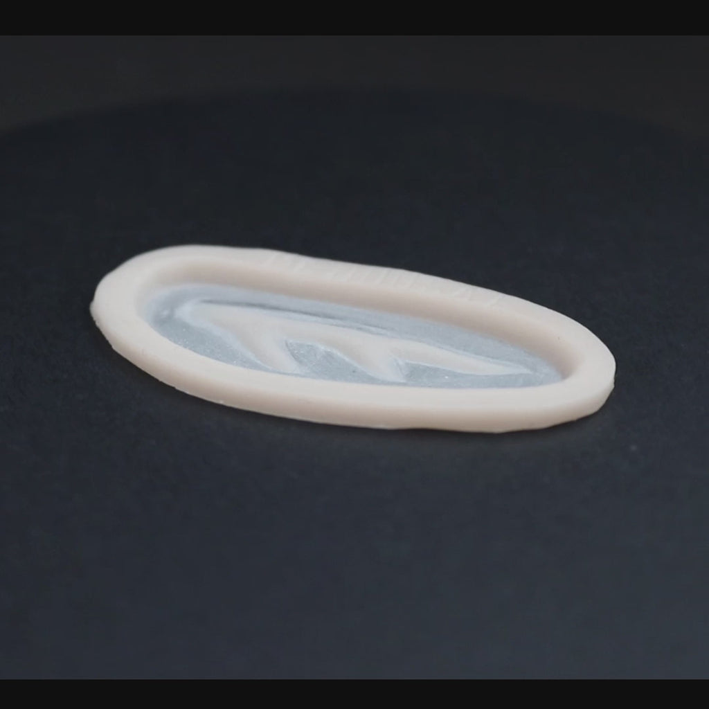 Antler scar prosthetic in vanilla shade on a black turntable, slowly rotating. 