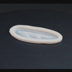 Antler scar prosthetic in vanilla shade on a black turntable, slowly rotating. 