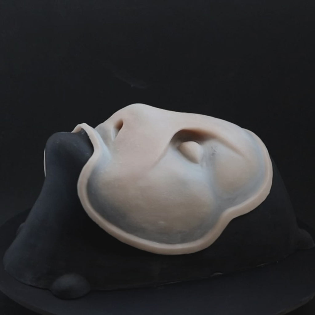 Sand Dweller prosthetic in vanilla shade on a black turntable, slowly rotating. 