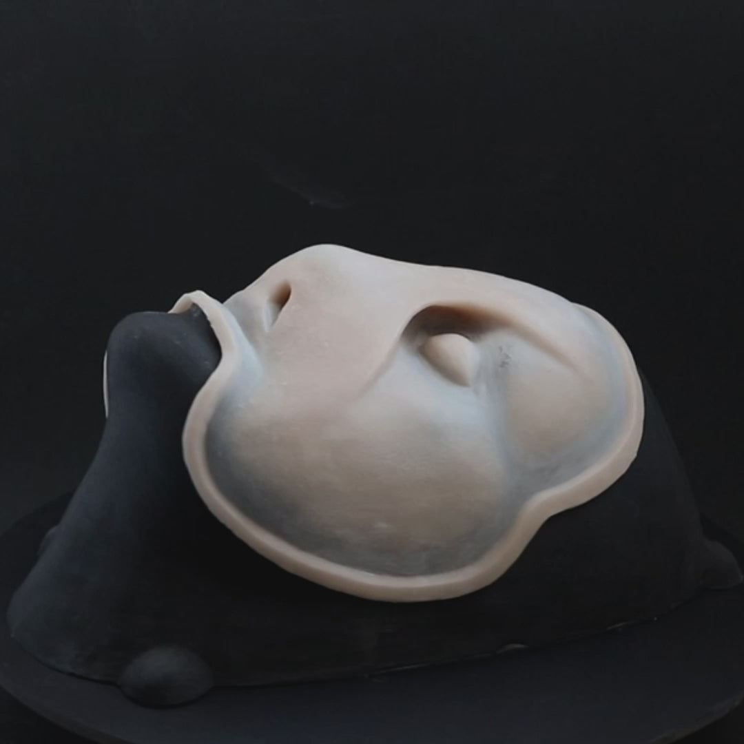 Sand Dweller prosthetic in vanilla shade on a black turntable, slowly rotating. 