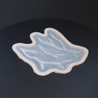 Veins C prosthetic in vanilla shade on a black turntable, slowly rotating. 