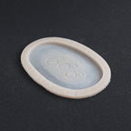 666 Carving prosthetic in vanilla shade at an angle on a black surface