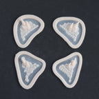 Alligator Scales temples and cheeks in vanilla shade on a black surface.