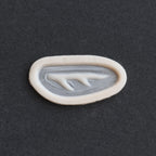 Antler Scar - Silicone makeup prosthetic in vanilla shade on a black surface