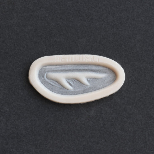 Antler Scar - Silicone makeup prosthetic in vanilla shade on a black surface