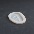 Antler Scar - Silicone makeup prosthetic in vanilla shade on a black surface