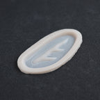 Antler Scar - Silicone makeup prosthetic in vanilla shade on a black surface