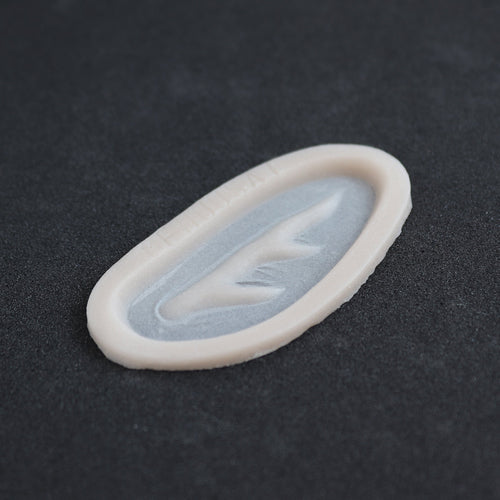 Antler Scar - Silicone makeup prosthetic in vanilla shade on a black surface