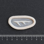 Antler Scar - Silicone makeup prosthetic in vanilla shade on a black surface