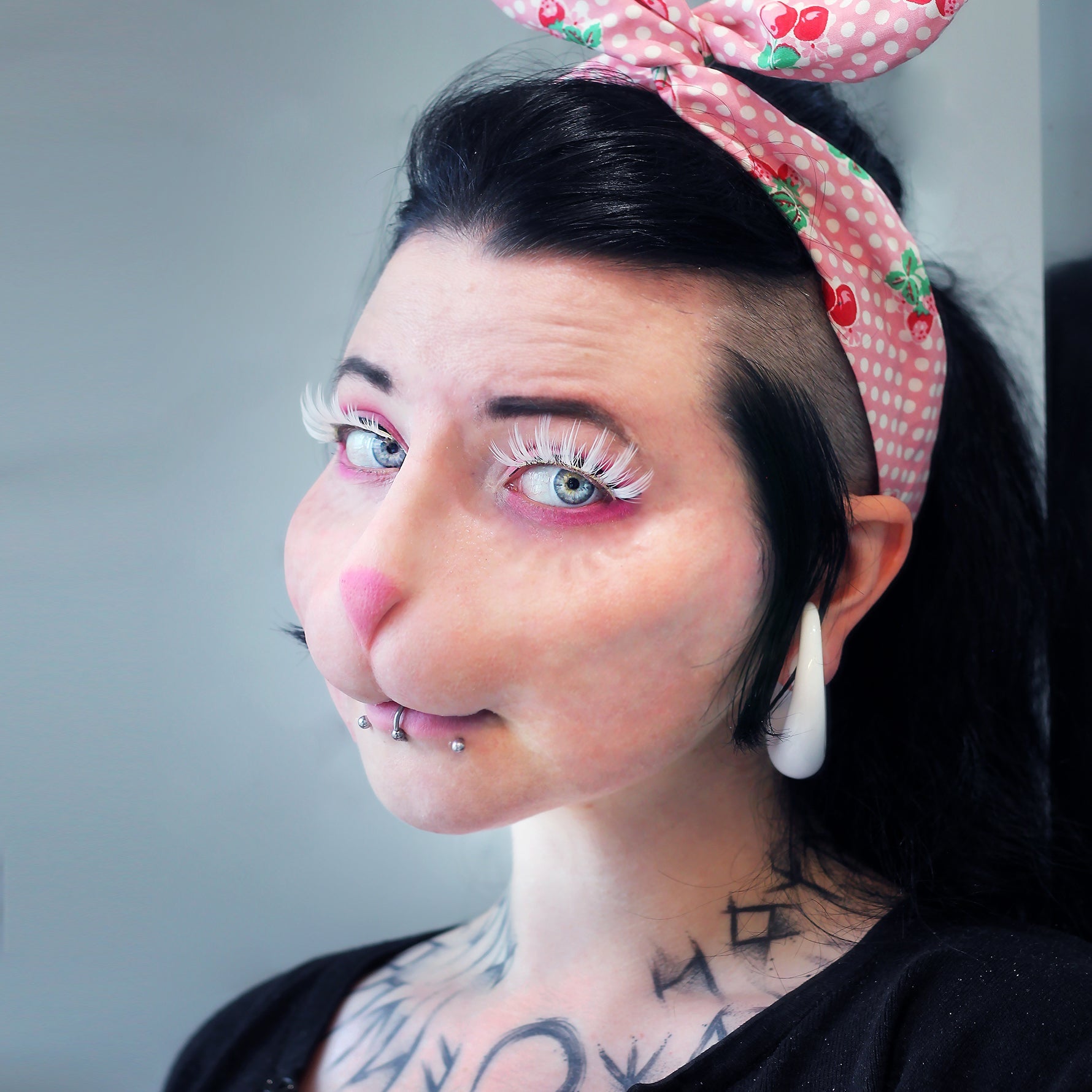 Woman with black hair wearing a bunny nose prosthetic in vanilla shade