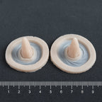 Crooked Horns (Pair) - Silicone makeup prosthetic in vanilla shade on a black surface with a ruler