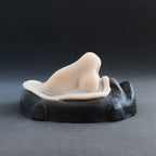 Crooked Nose - Silicone makeup prosthetic in vanilla shade on a black surface