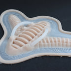 Cyborg Neck Piece - Silicone makeup prosthetic in vanilla shade on a black surface