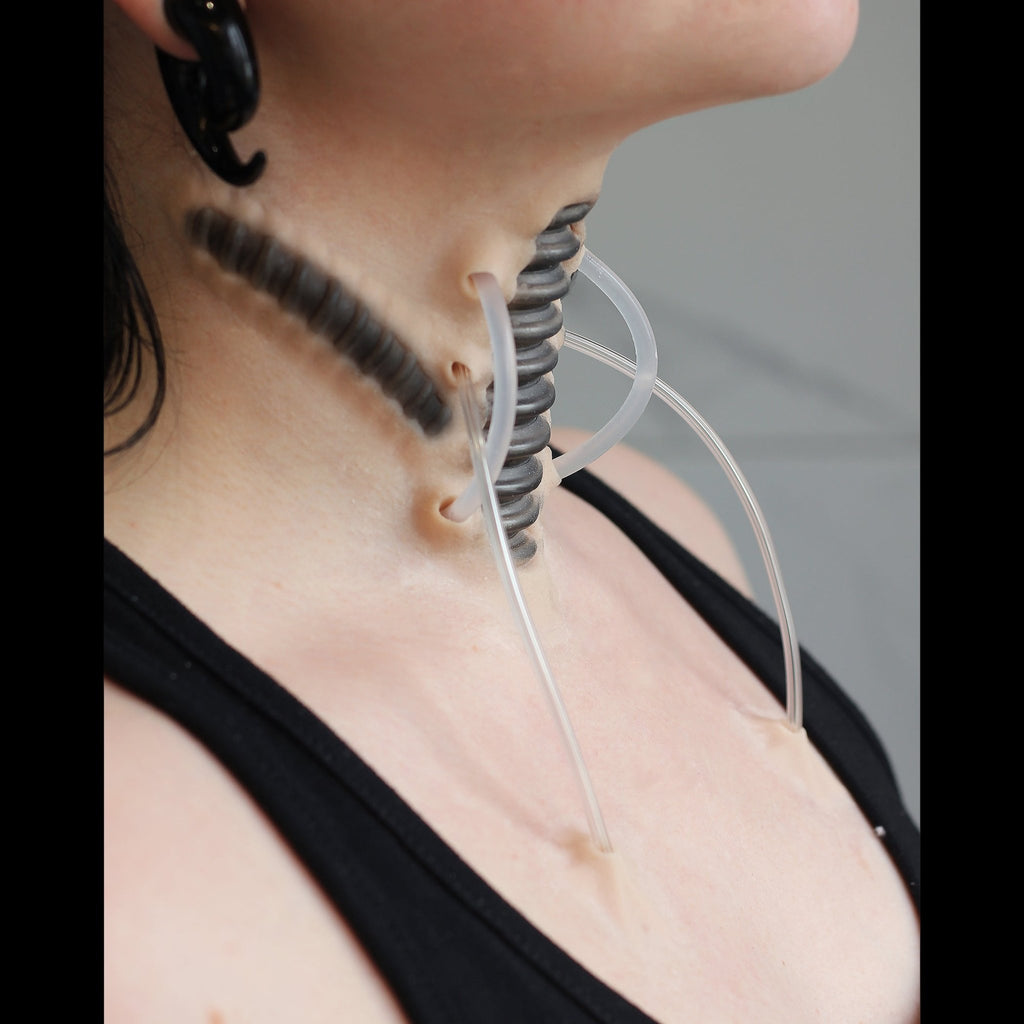 Cyborg Neck Piece, with black makeup, on a neck