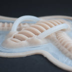 Cyborg Neck Piece - Silicone makeup prosthetic in vanilla shade on a black surface