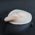 Demon Tail - Silicone makeup prosthetic in vanilla shade on a black surface