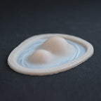 Double Subdermal Horns (Pair) - Silicone makeup prosthetic in vanilla shade on a black surface