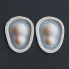 Double Subdermal Horns (Pair) - Silicone makeup prosthetic in vanilla shade on a black surface