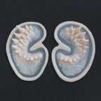 Dragon Half Face - Silicone makeup prosthetic in vanilla shade on a black surface