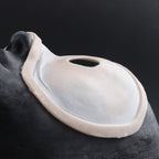 Eyeless - Silicone makeup prosthetic in vanilla shade on a black surface