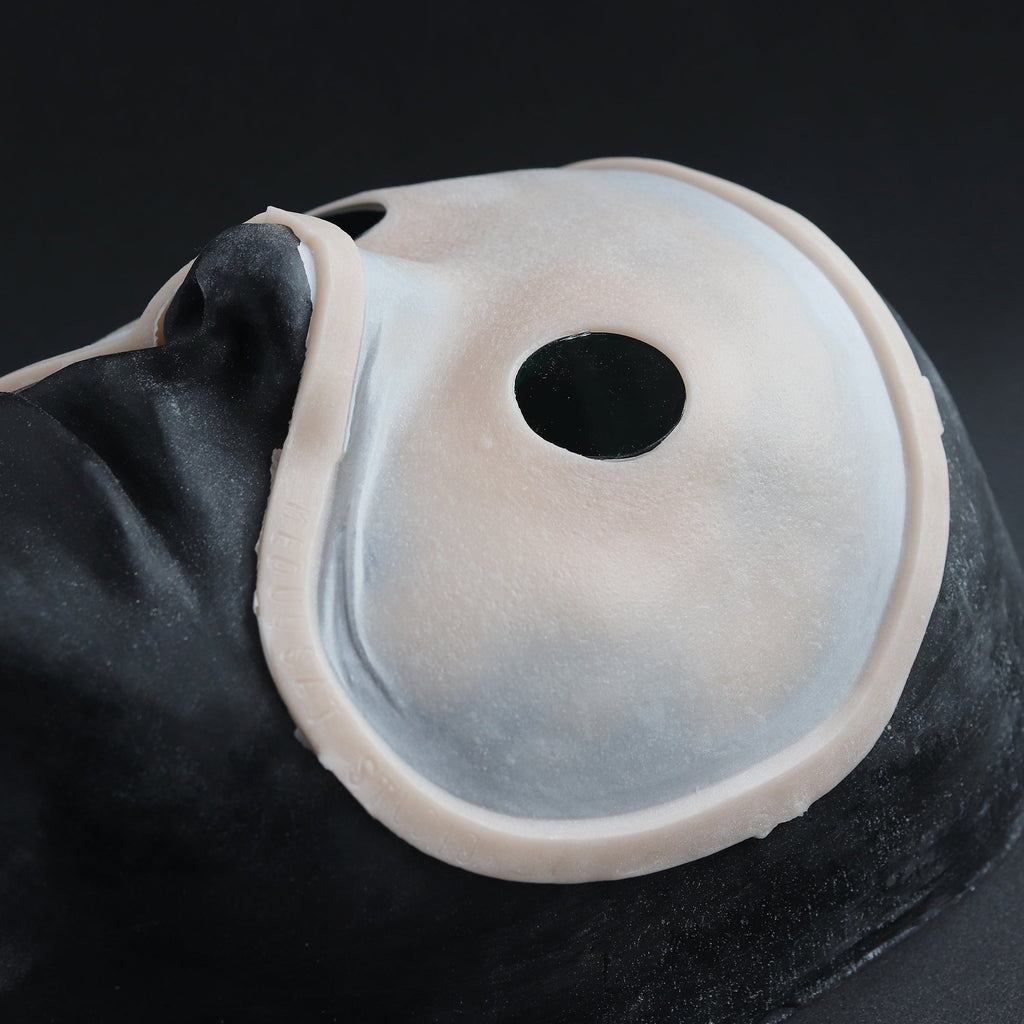 Eyeless - Silicone makeup prosthetic in vanilla shade on a black surface