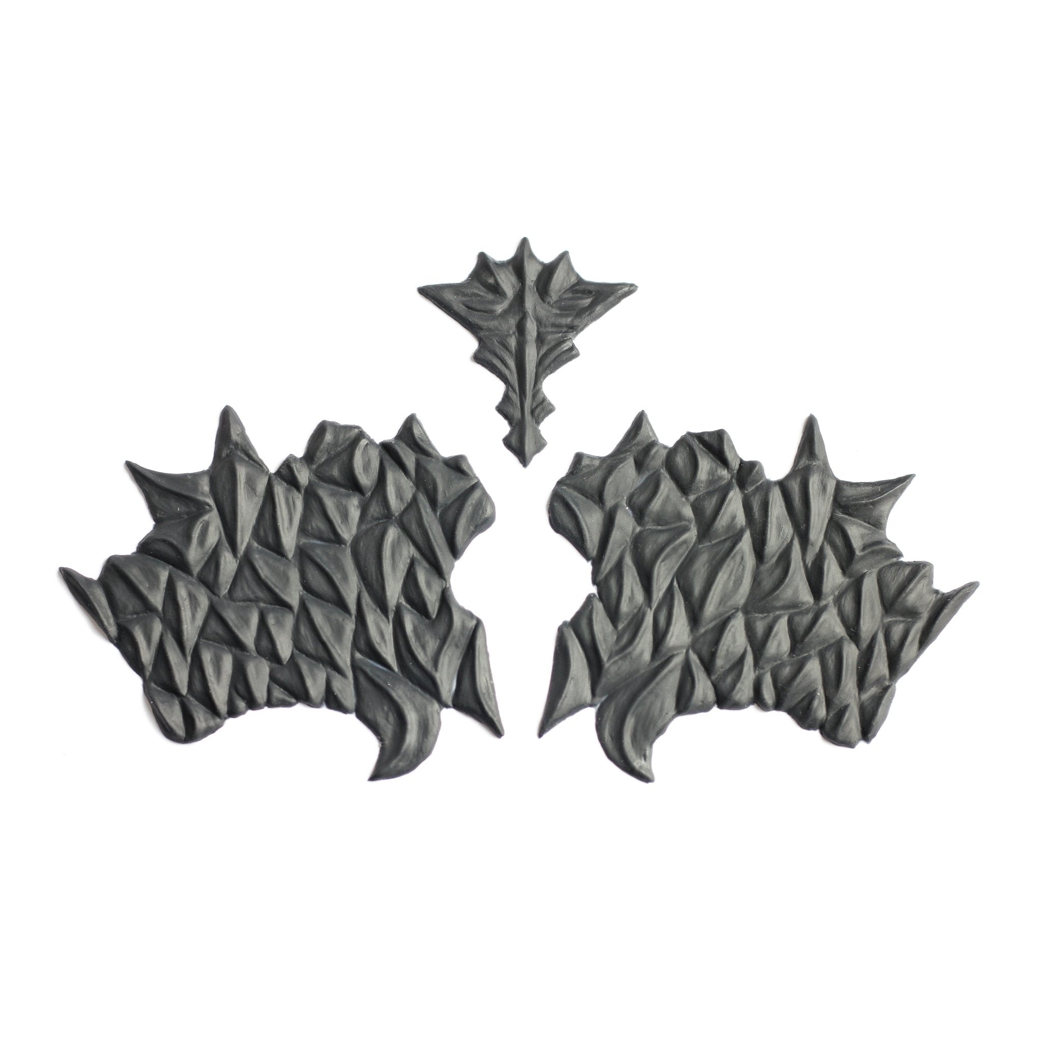 Facial Scales 2.0 - Silicone makeup prosthetic in black on a white surface