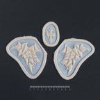 Facial Scales - Silicone makeup prosthetic in vanilla shade on a black surface with a ruler