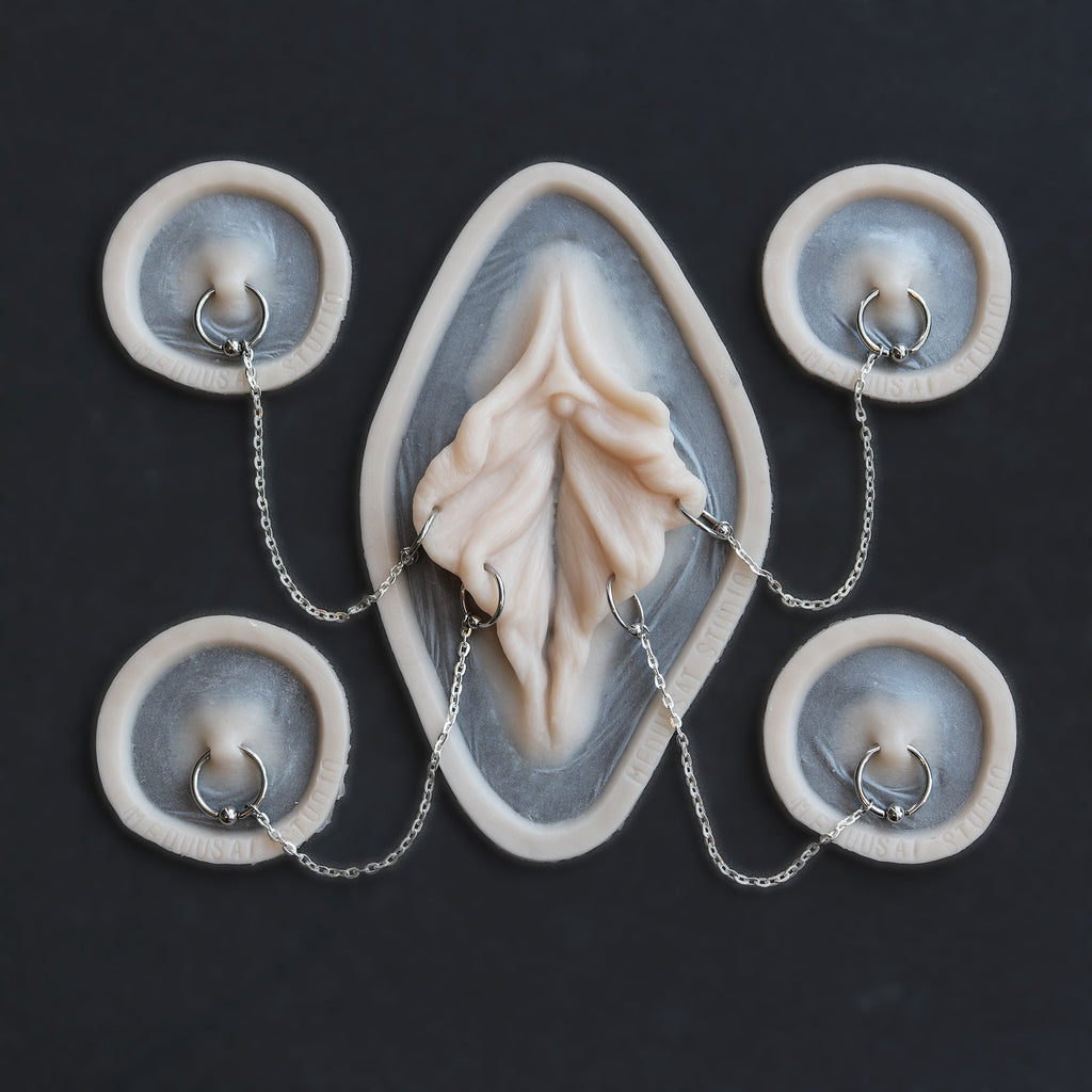 Flower Choker - Silicone makeup prosthetic in vanilla shade on a black surface