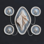 Flower Choker - Silicone makeup prosthetic in vanilla shade on a black surface