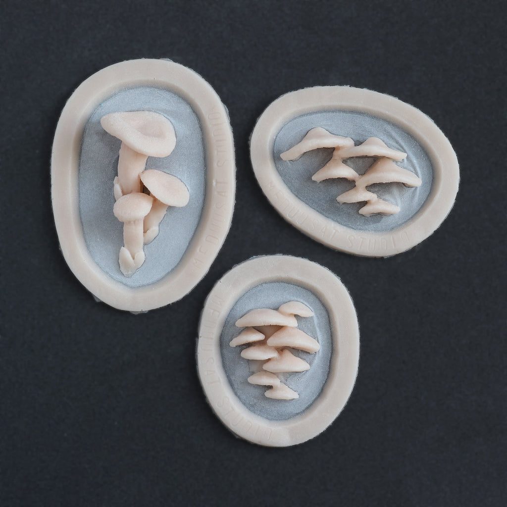 Fungi Set - Silicone makeup prosthetic in vanilla shade on a black surface