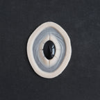 Gem - Silicone makeup prosthetic in vanilla shade on a black surface