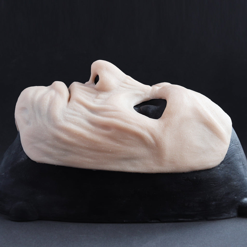 Ghoul Mask - Silicone makeup prosthetic in vanilla shade on a black surface