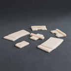 Hinges - Silicone makeup prosthetic in vanilla shade on a black surface