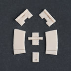 Hinges - Silicone makeup prosthetic in vanilla shade on a black surface