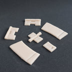 Hinges - Silicone makeup prosthetic in vanilla shade on a black surface