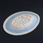 Large Wound - Silicone makeup prosthetic in vanilla shade on a black surface