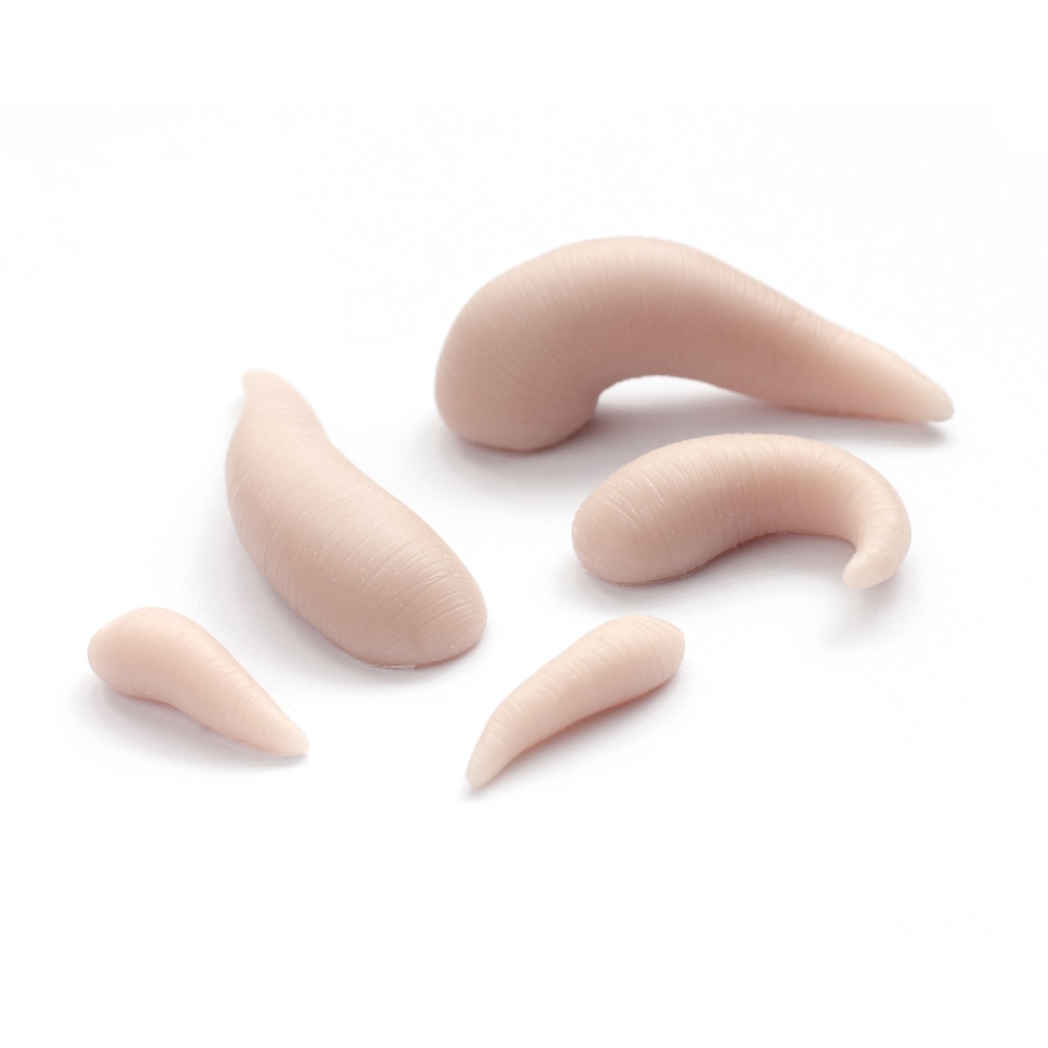Leeches - Silicone makeup prosthetic in vanilla shade on a white surface