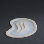 Manta Gills (Pair) - Silicone makeup prosthetic in vanilla shade on a black surface