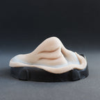 Manta Nose - Silicone makeup prosthetic in vanilla shade on a black surface