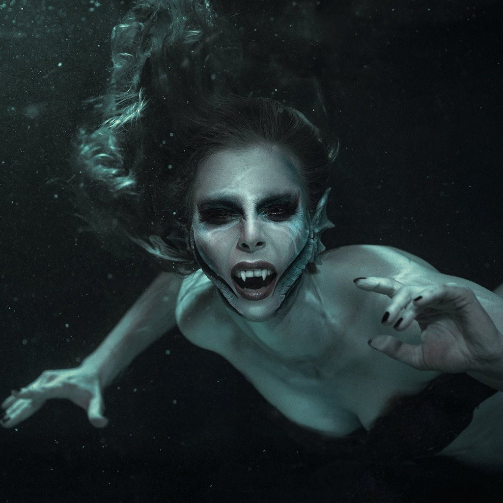 Blue mermaid wearing mermaid gills