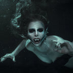 Blue mermaid wearing mermaid gills