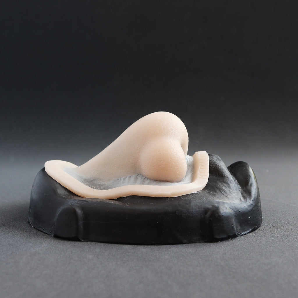 Nordic Troll Nose - Silicone makeup prosthetic in vanilla shade on a black surface