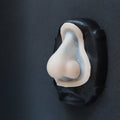 Nordic Troll Nose - Silicone makeup prosthetic in vanilla shade on a black surface