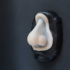Nordic Troll Nose - Silicone makeup prosthetic in vanilla shade on a black surface