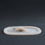 Nose Bridge - Silicone makeup prosthetic in vanilla shade on a black surface